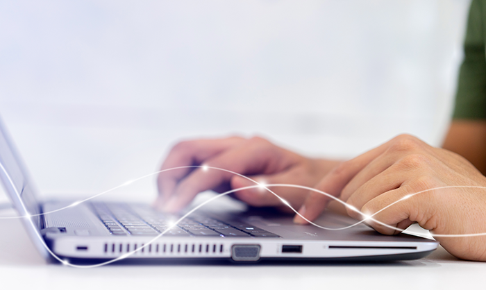 Person typing on laptop