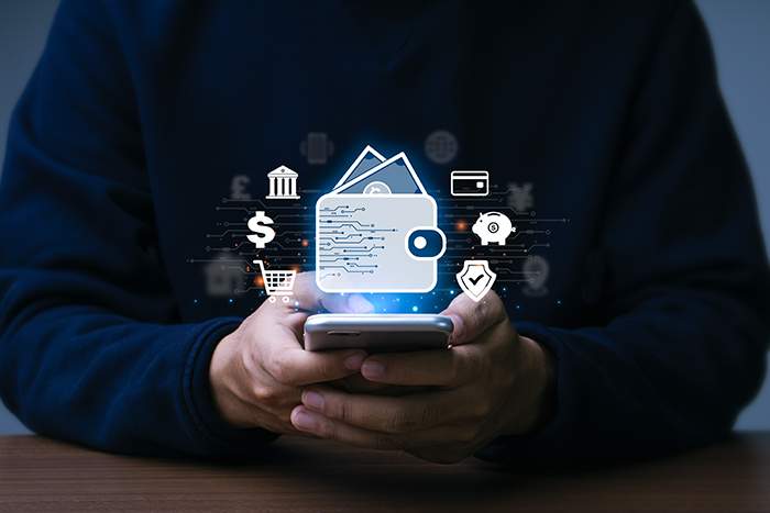 Person holding phone with digital wallet icon and shopping icons around